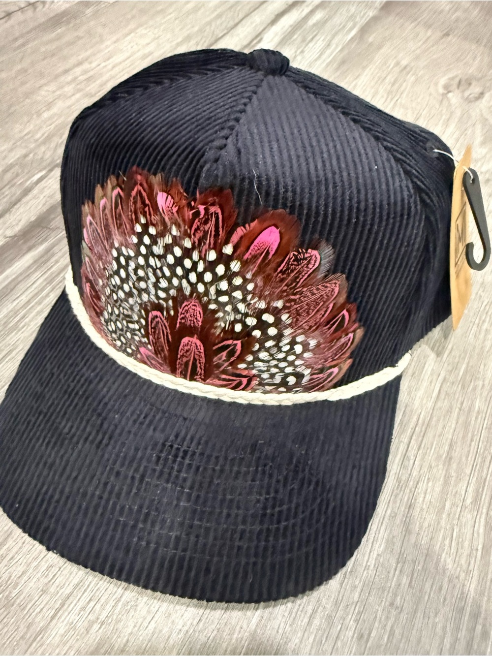 Women’s Black Corduroy Cap with Feather Embellishment